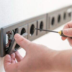 wall-socket-installation-a-screw-on-an-electrical-outlet-wall-construction-cable-power-wiring_t20_A94EZW